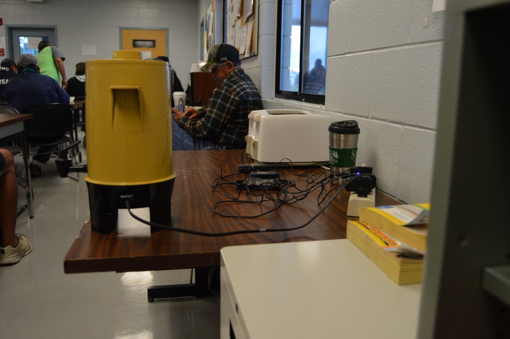 Workers can charge their cell phones and have a cup of coffee while waiting for work. – Photo by Michael Olinger