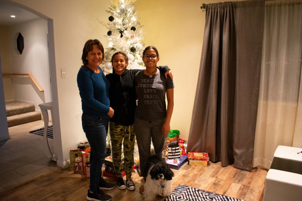Valenzuela with her family in her living room
