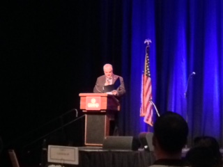 Gov. Steve Sisolak at podium on stage