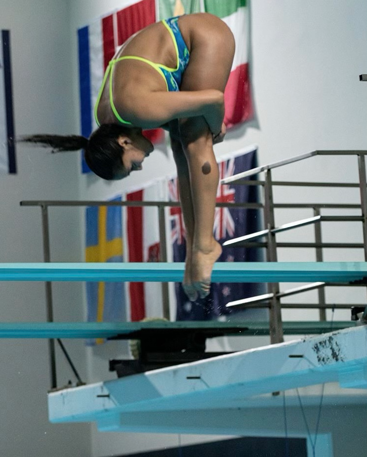 Isabel Vazquez leaps off a diving board 