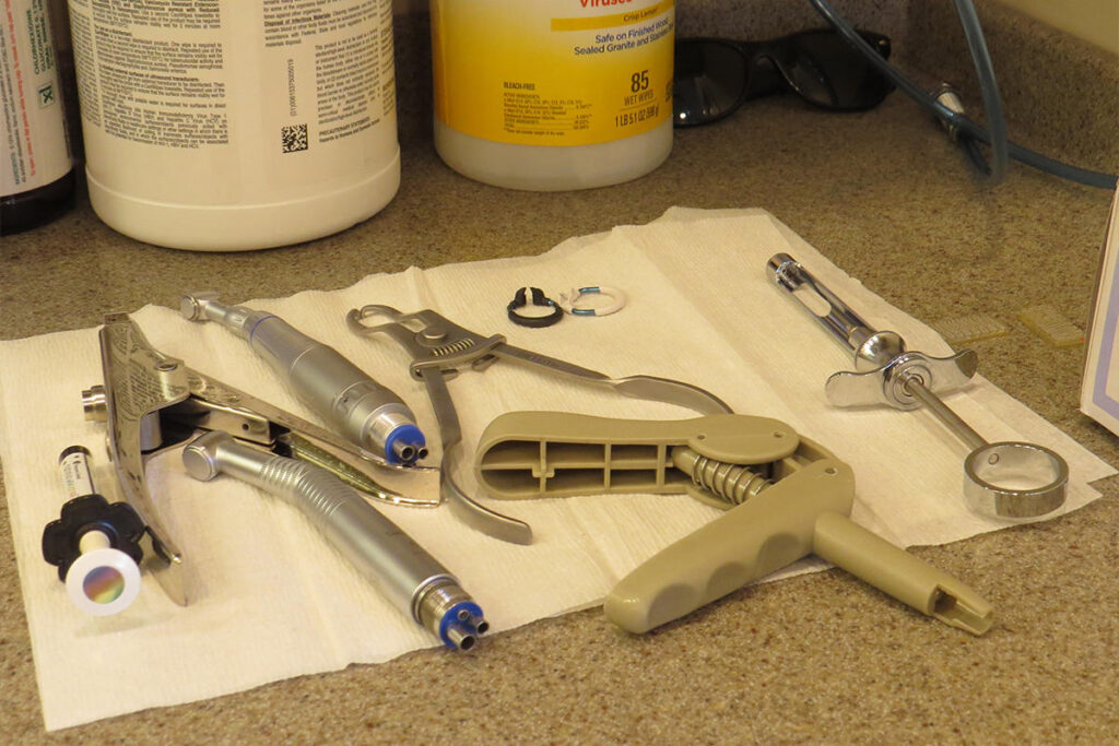 Dental tools laid out on a paper towel on top of a counter inside the mobile dental van. 