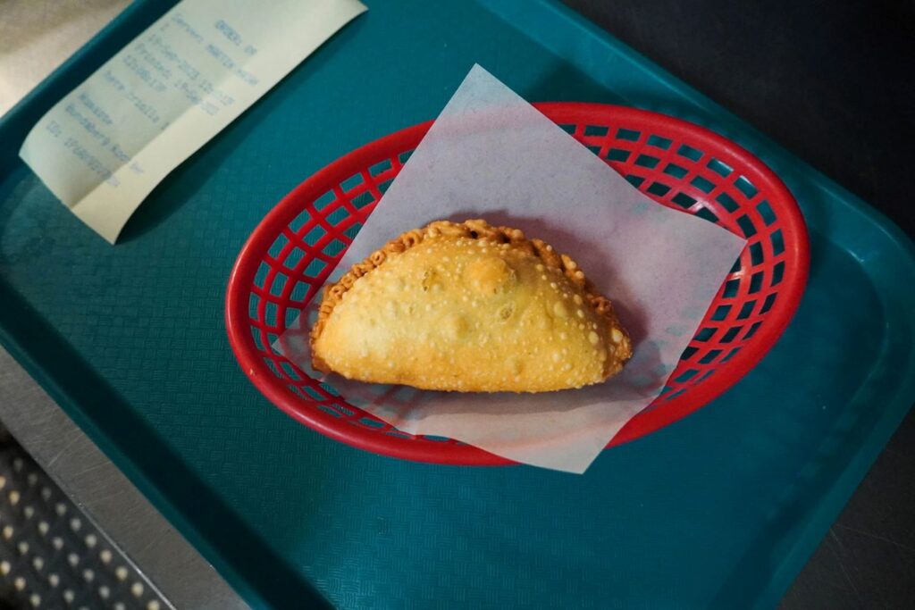 Empanada is pictured in a basket from birds eye view