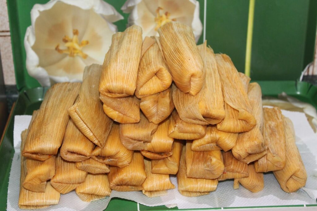 A pyramid of tamales stacked up.