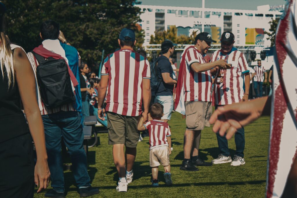 dad and son walk with their Paraguay jerseys on