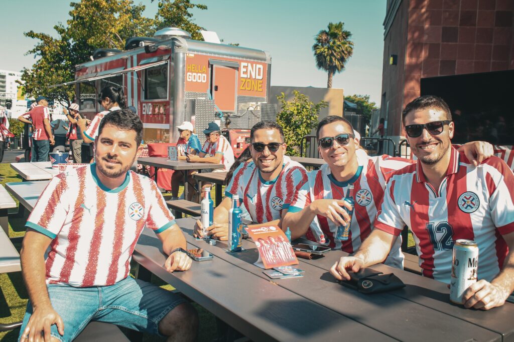 Four men wearing their Paraguay soccer jerseys