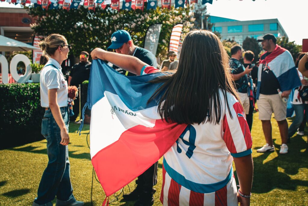 woman holds up Paraguay flag