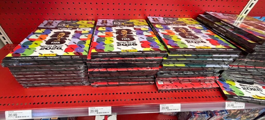 stacks of colorful empty sticker albums