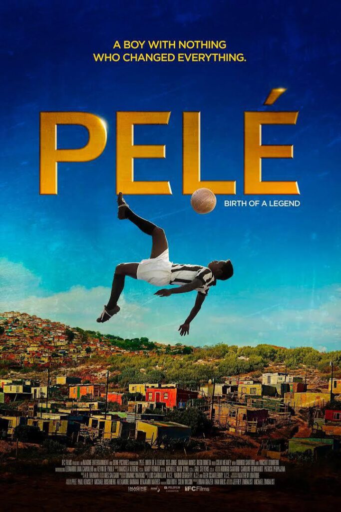 soccer player doing a scissor kick with city in background