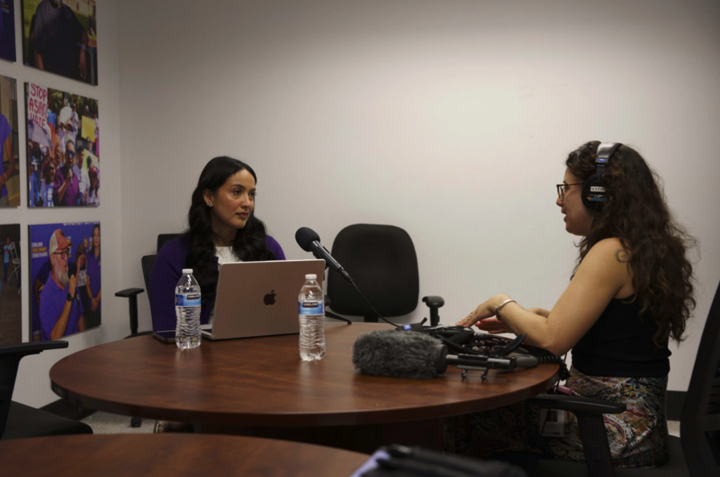 reporter interviews woman
