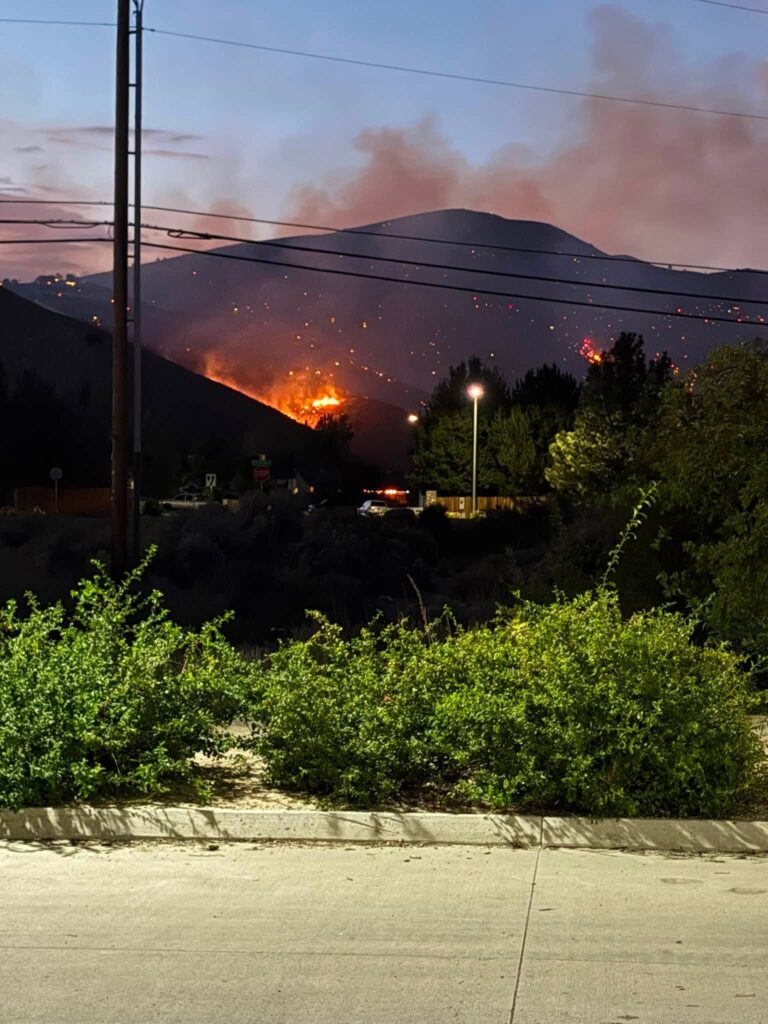 flames on hill in the background