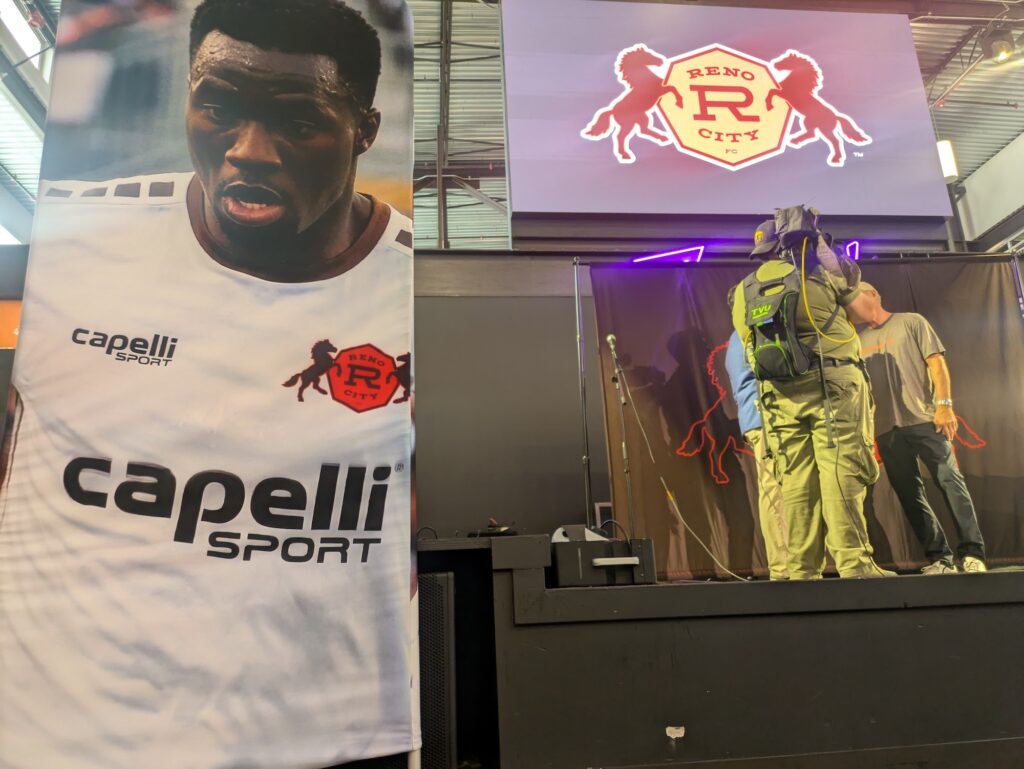 large poster of player wearing white soccer jersey