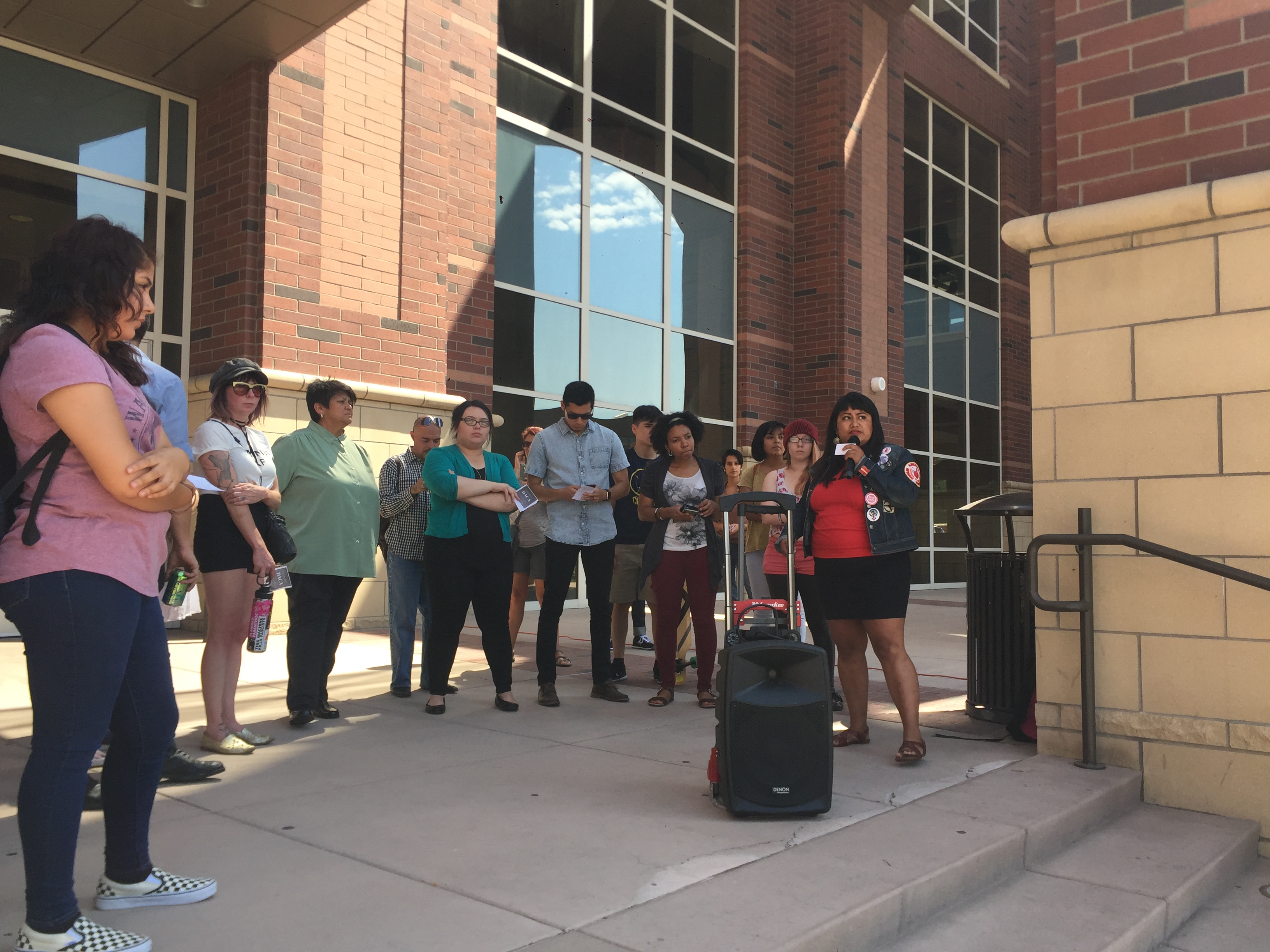 Xóchítl Pāpalōtl organized the Walk Out In Support Of DACA Students and speaks to the crowd gathered in front of the Knowledge Center.