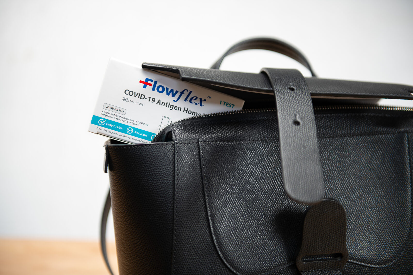 One test box for COVID-19 in women's handbag