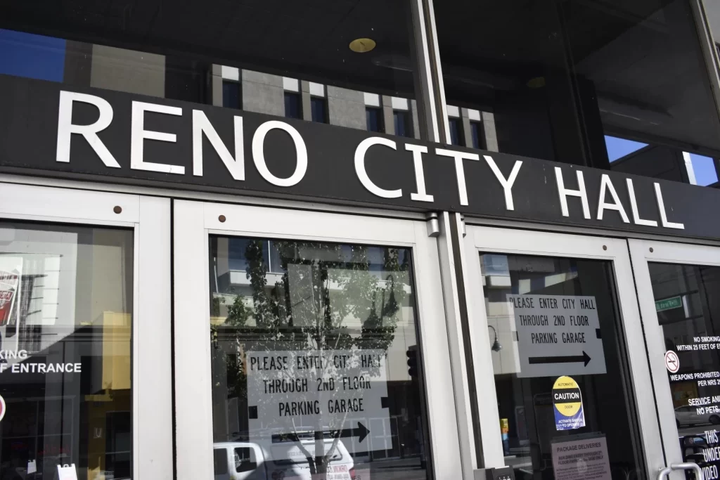 a picture of the city hall is shown with Reno City Hall focused
