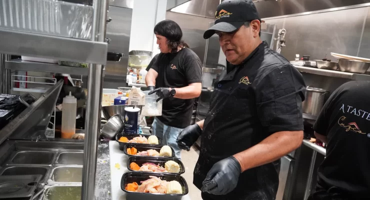 cooks prepare food at peruvian restaurant