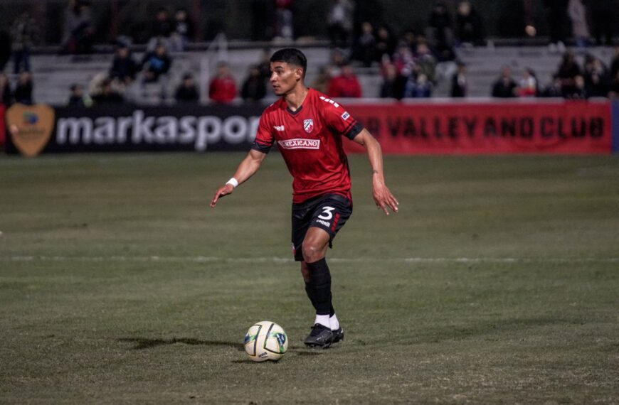 Jesus Partida in the soccer field with the soccer ball by his feet