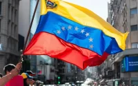 Man waves Venezuelan flag