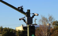 A camera mounted on a streetlamp used to read license plates