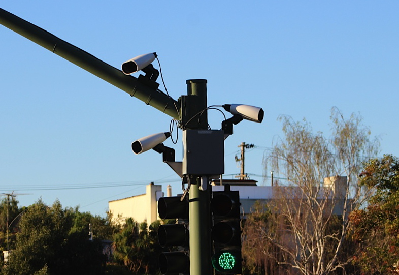 A camera mounted on a streetlamp used to read license plates