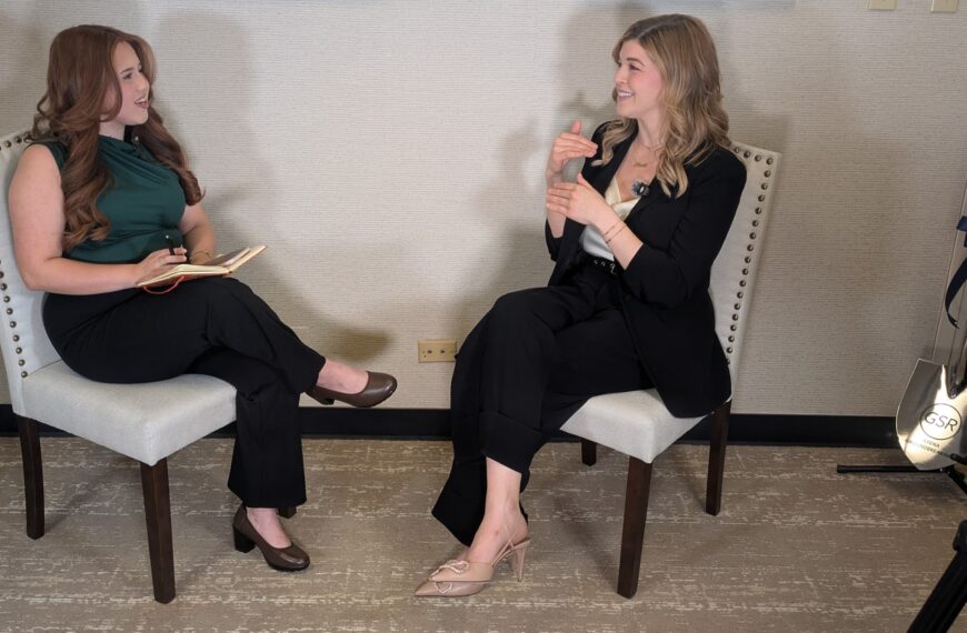 two women seated facing one another in an interview