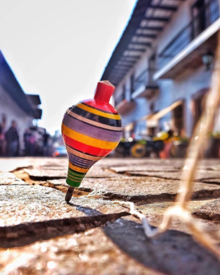 spinning top on a street