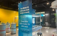 a blue poster with white lettering inside a hall