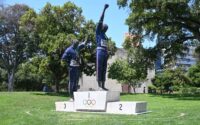 statue of Olympians with raised fists
