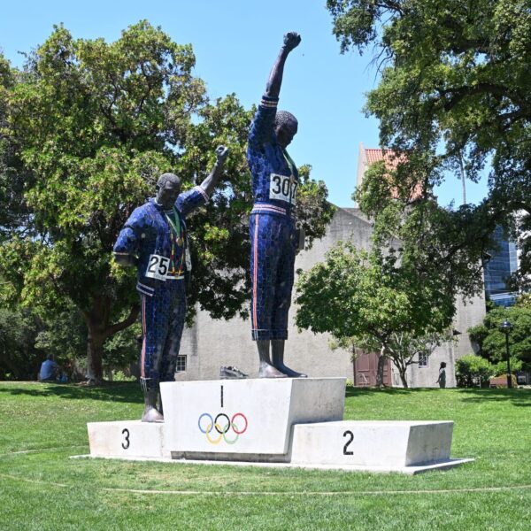 statue of Olympians with raised fists