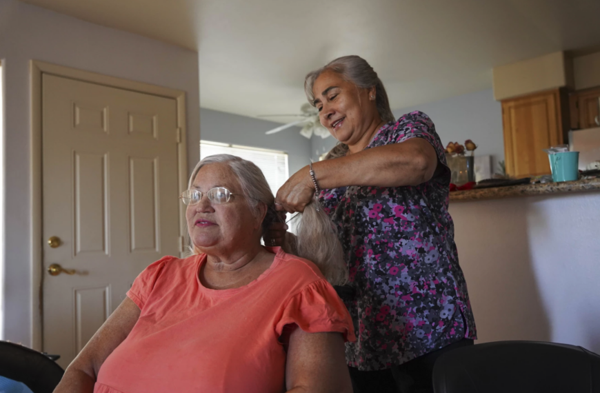 woman braids hair of another woman
